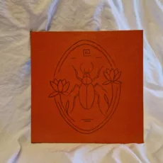 illustration scarabée lotus ovale orange géométrique